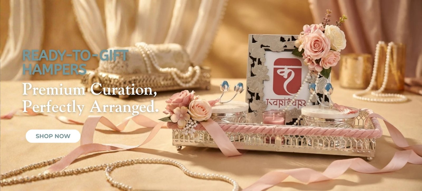 Hero banner: luxury ready-to-gift hampers with pink roses, pearls, and a &lsquo;Shop Now&rsquo; button.