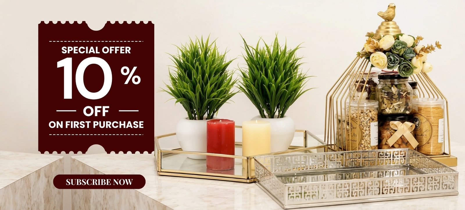 Promotional banner offering 10% off on first purchase with a 'Subscribe Now' button, set beside decor items on a marble counter.